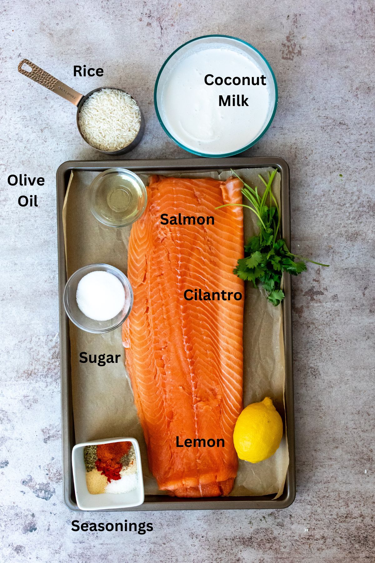 Ingredients needed on a cooking sheet and in small dishes. 