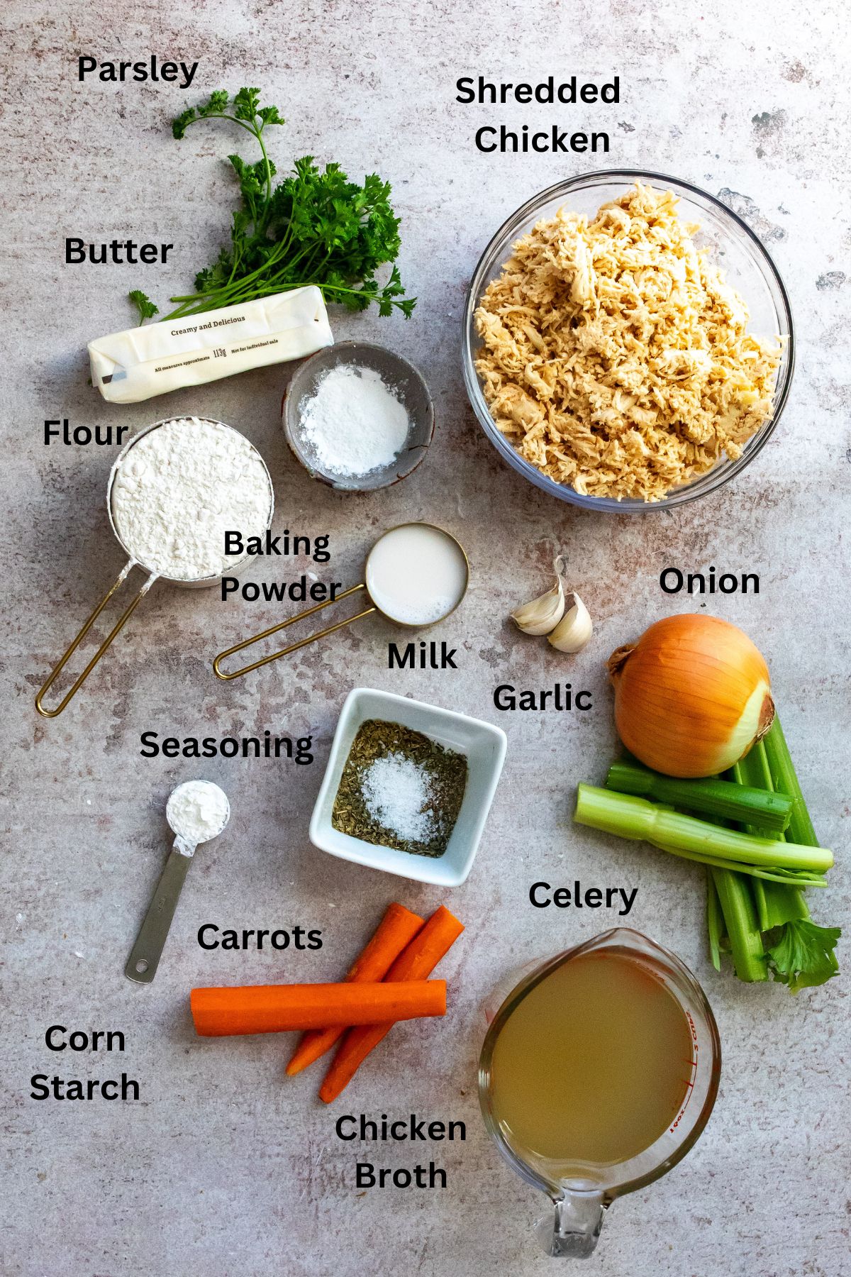 All the ingredients in small bowls, measuring cups and laid out on a counter. 