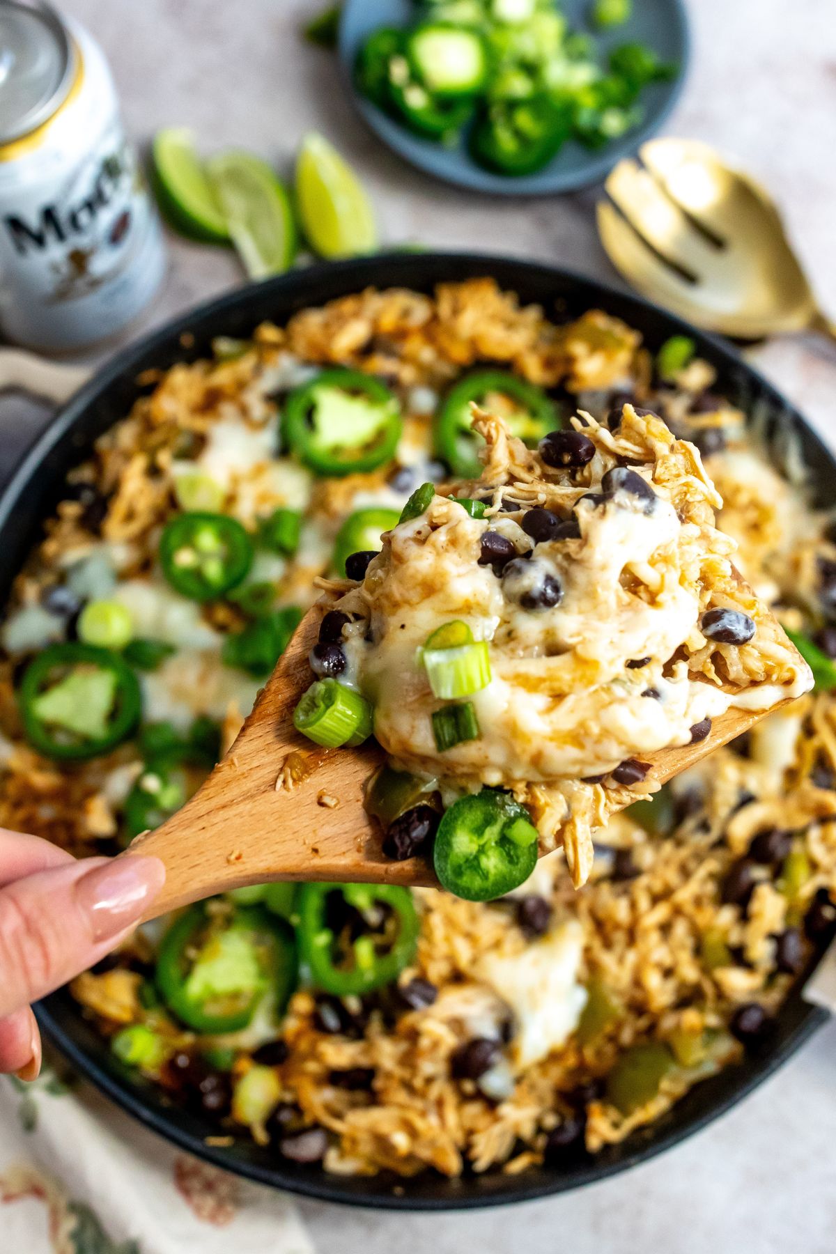 A spoonful of the chicken skillet over a cast iron skillet. 