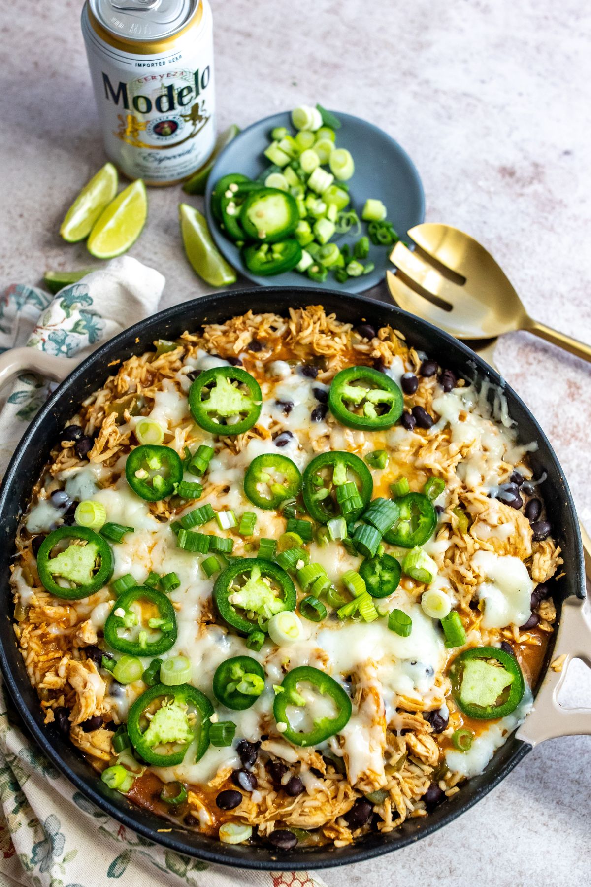 Skillet filled with chicken, cheese and jalapeños. 