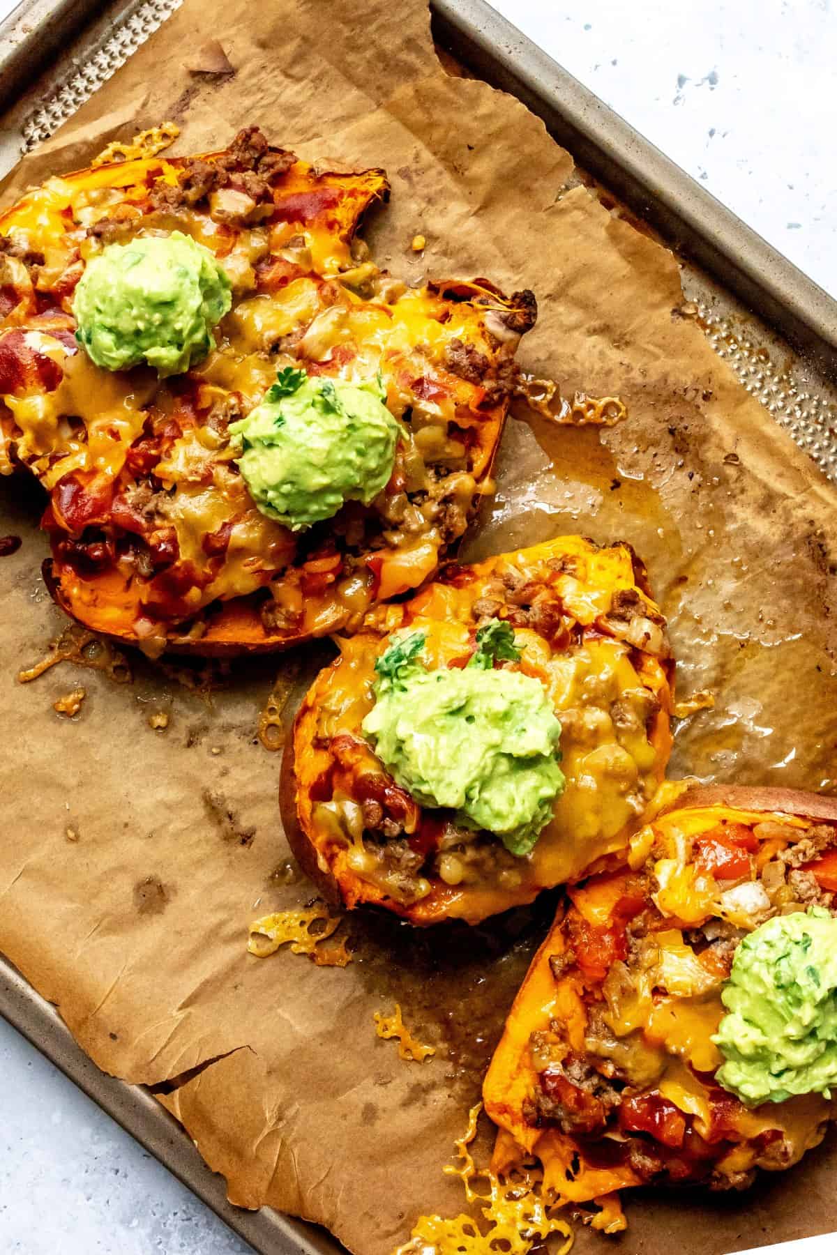Stuffed Sweet Potatoes on a parchment lined baking sheet.