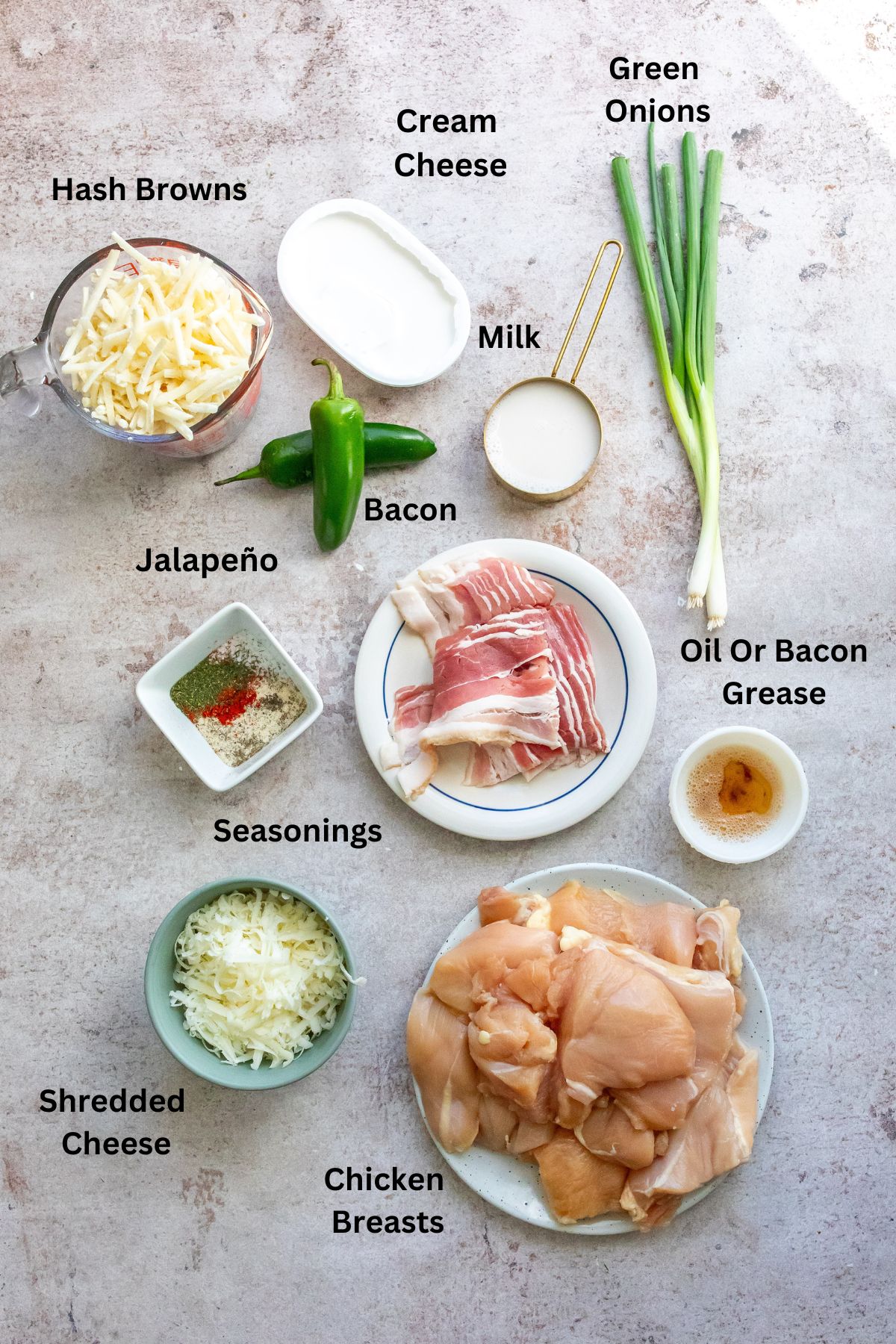 Ingredients needed to make this recipe in small bowls and containers on a white counter. 