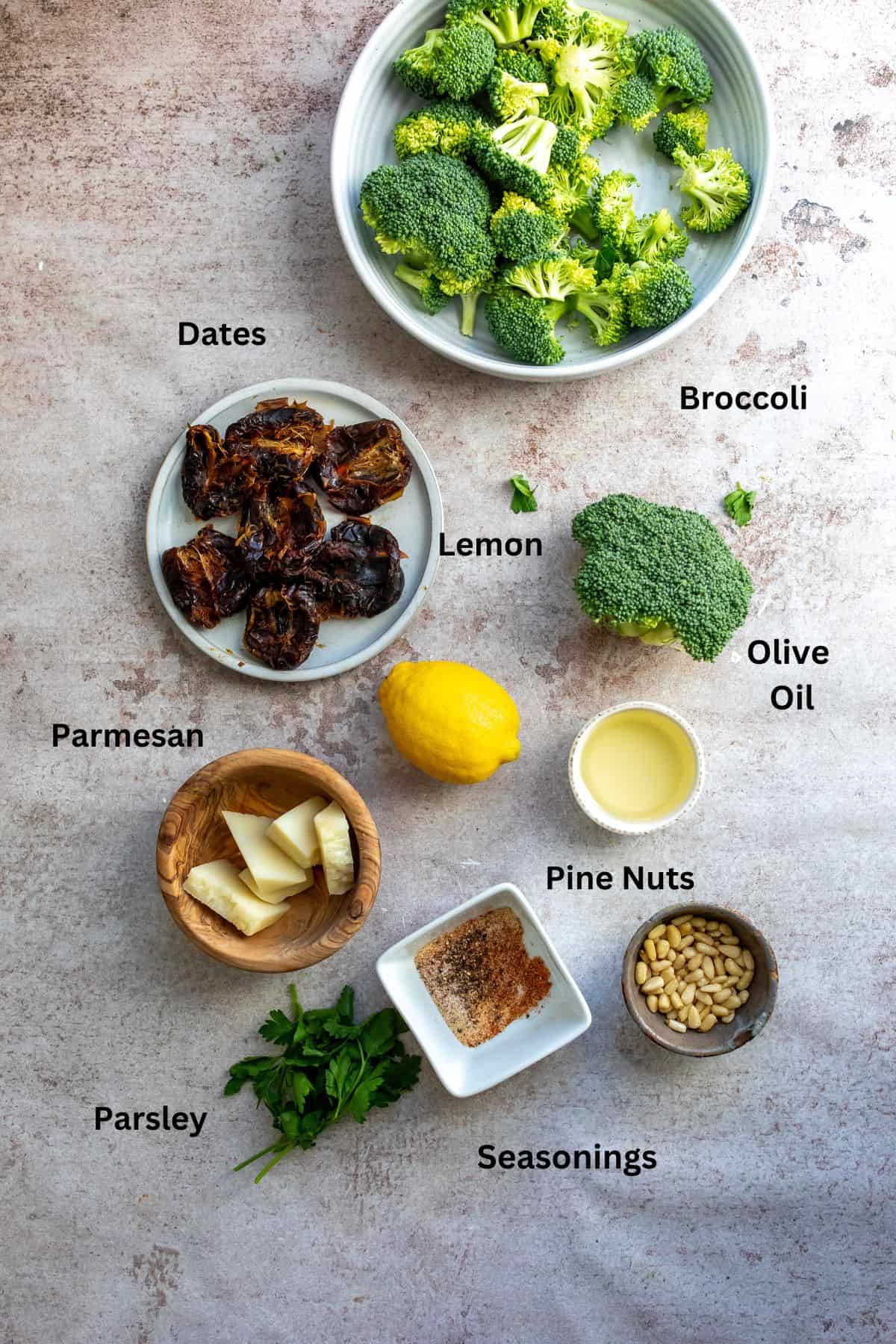 Seasonings, lemons and ingredients needed to make this meal in small bowls. 