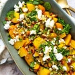 Roasted Golden Beets on a green serving plate with toppings.