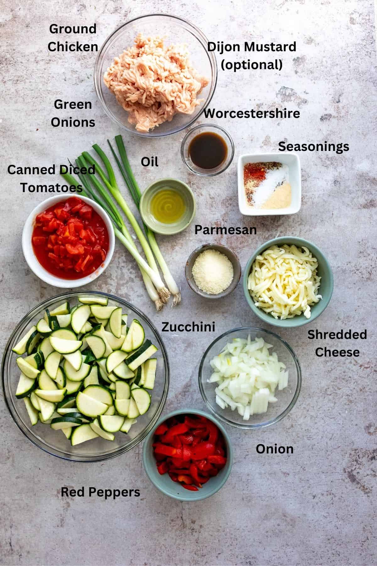 Ingredients needed to make this zucchini bake on a counter in bowls. 