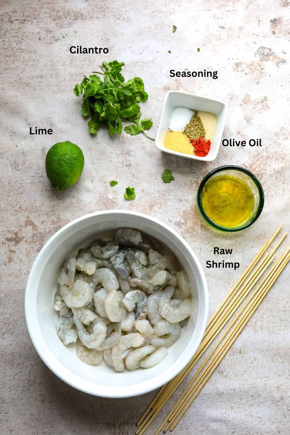 Ingredients to make Shrimp Skewers in the Oven in small bowls. 