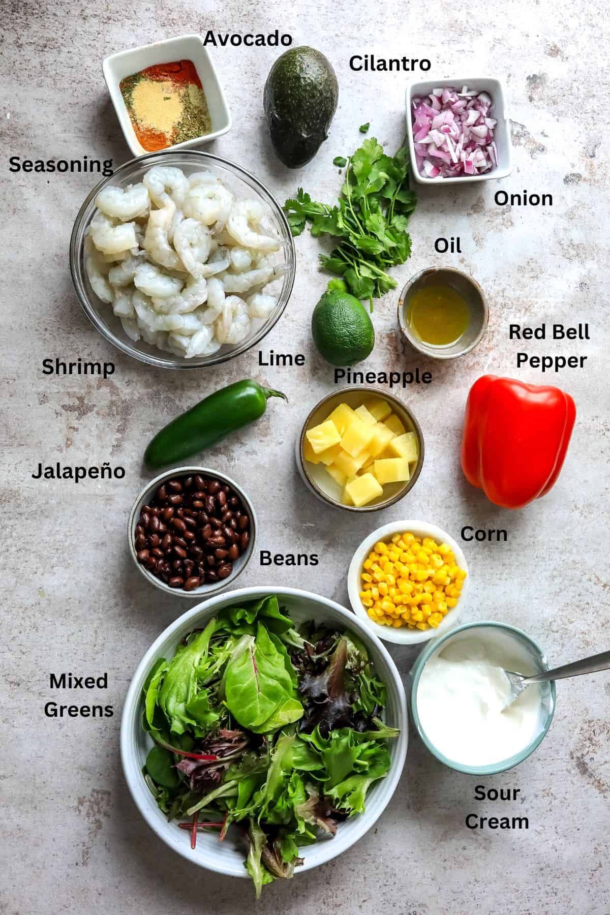 Ingredients needed on a counter in small bowls and cups. 