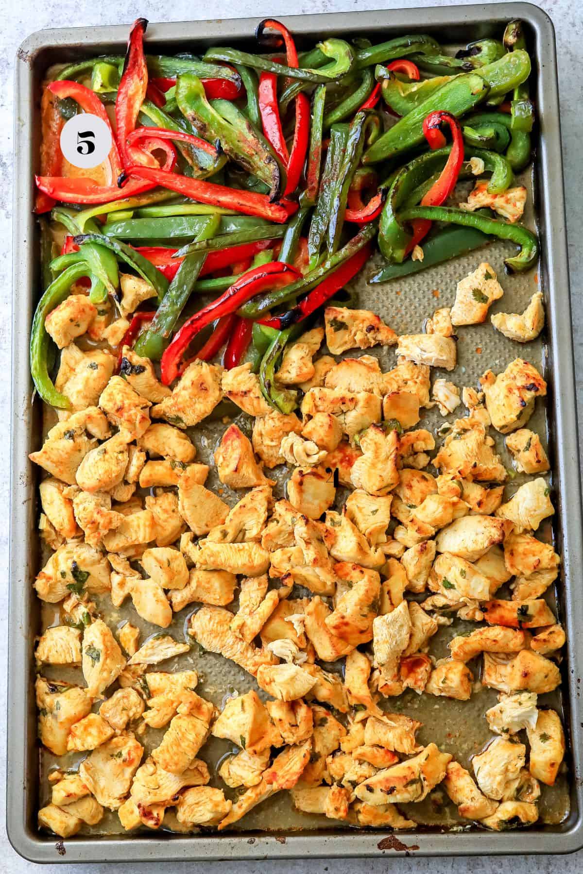 A baking sheet with cooked cilantro lime chicken  and fajitas to the side. 