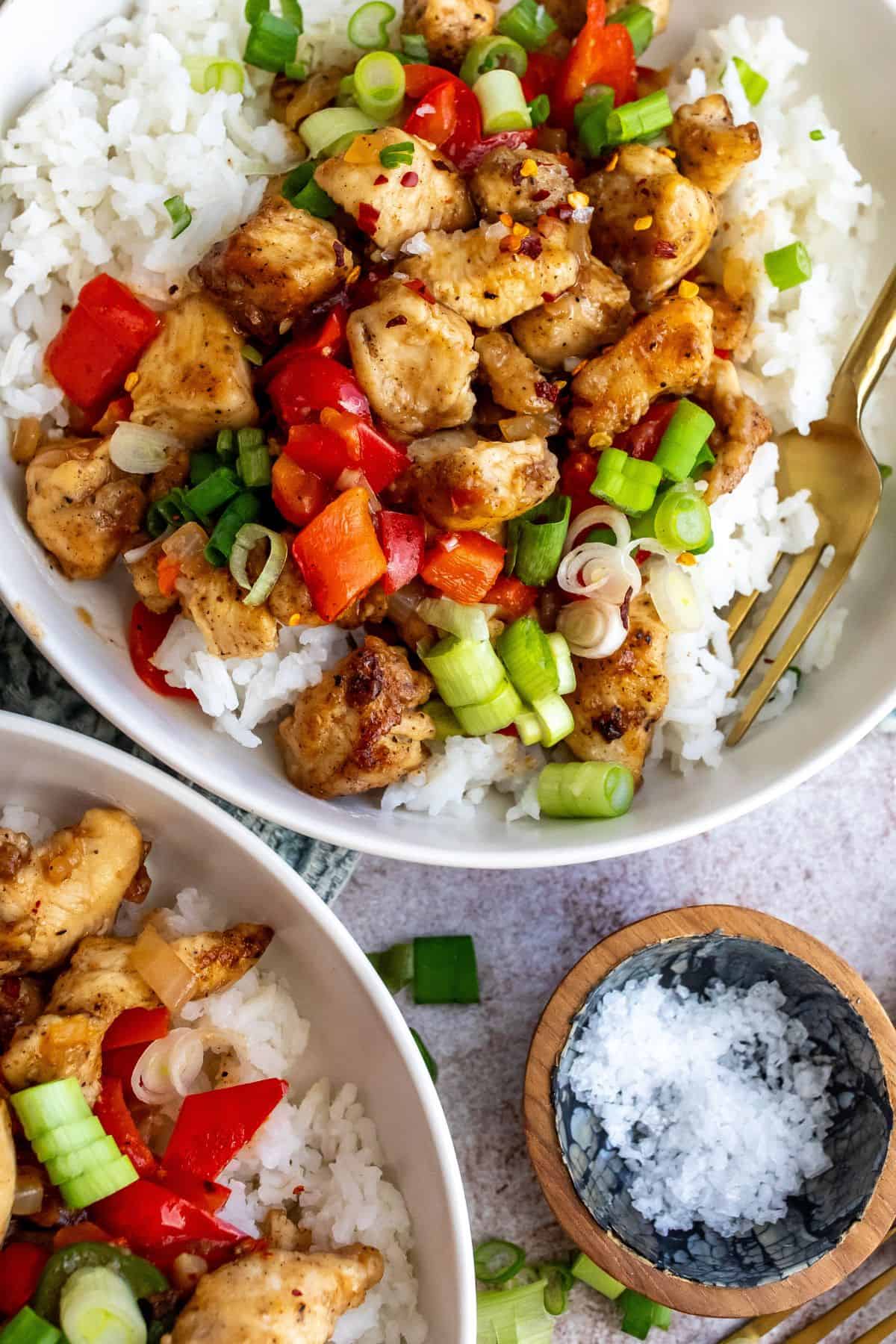 Crispy Chicken with salt and pepper seasonings. Up close in a white bowl.