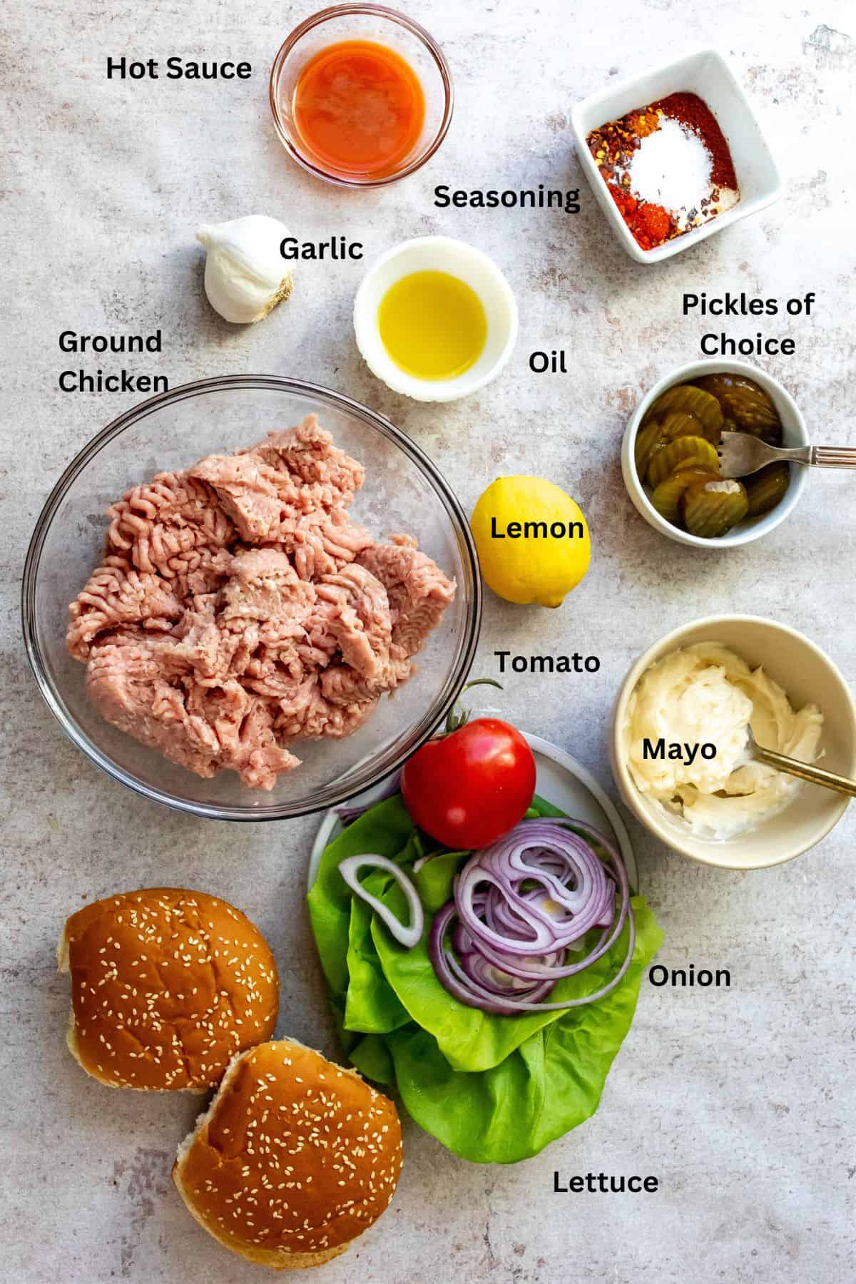 Ingredients needed to make air fryer chicken burgers on a counter. 