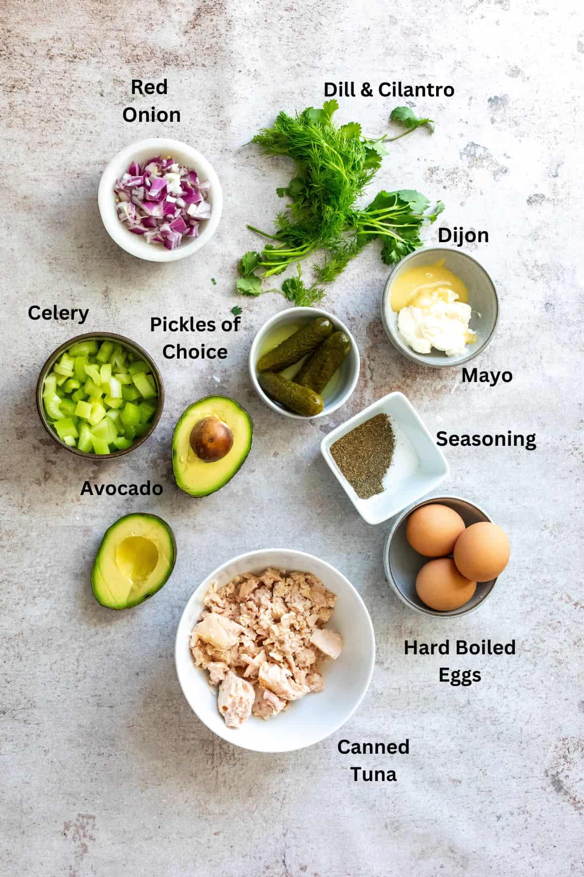 Ingredients needed for recipe to make egg and tuna salad sandwiches.