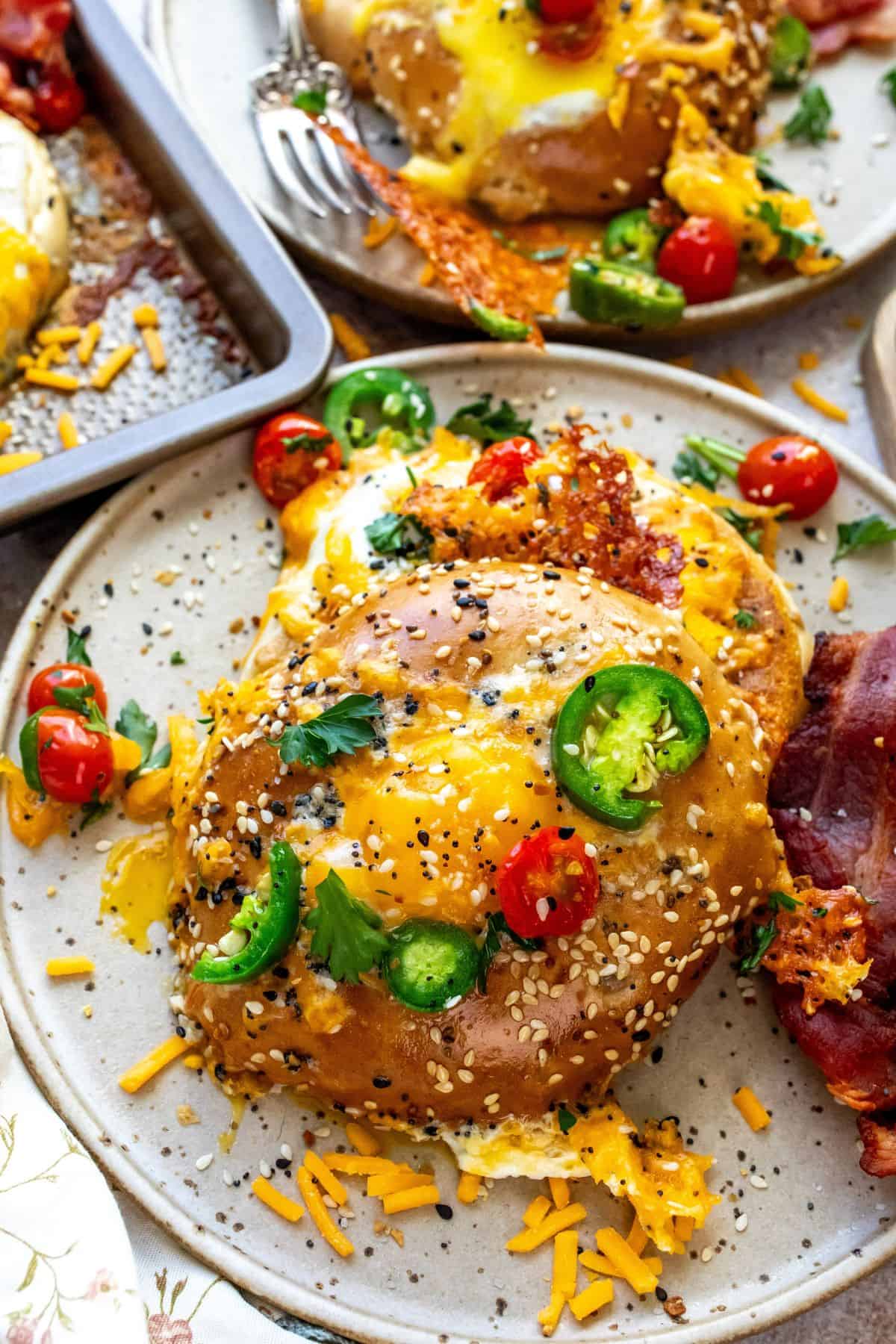 eggs in bagel holes on plates. 