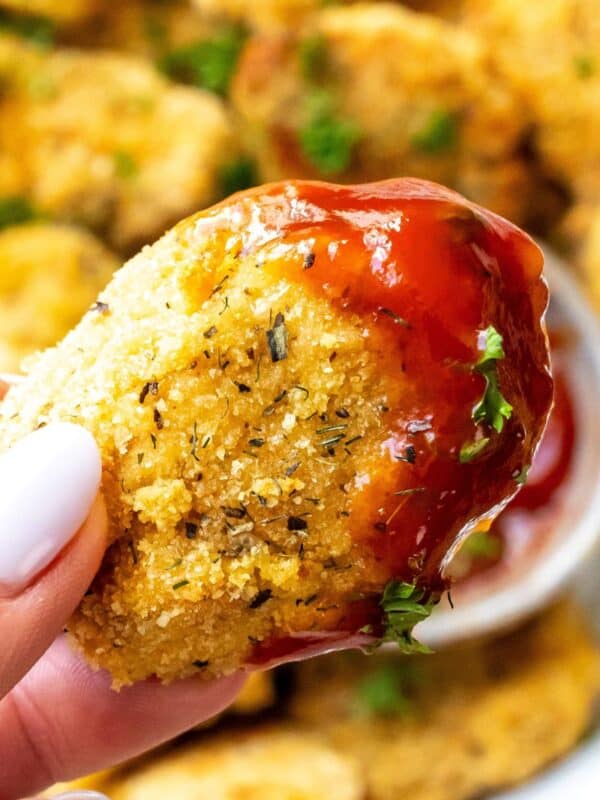 Chicken nugget with ketchup on it.