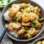 An image of honey walnut shrimp in a bowl over rice.