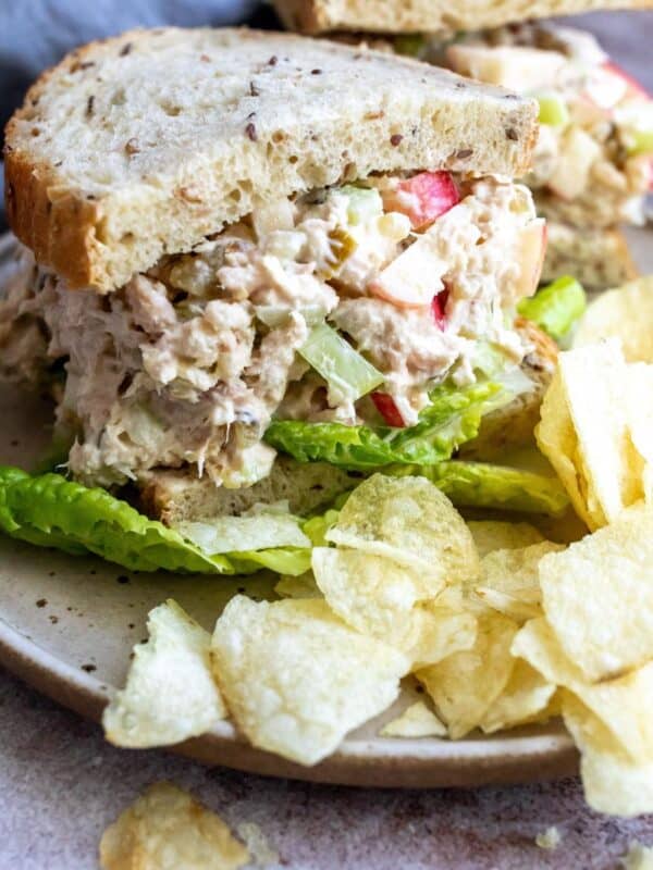 Tuna and apple salad on bread with chips