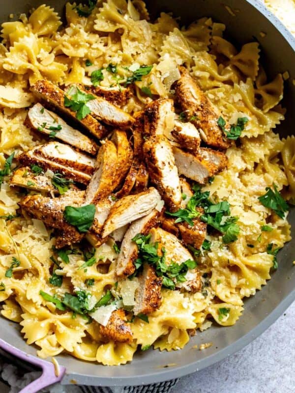 An overhead image of garlic parmesan chicken pasta in a skillet.
