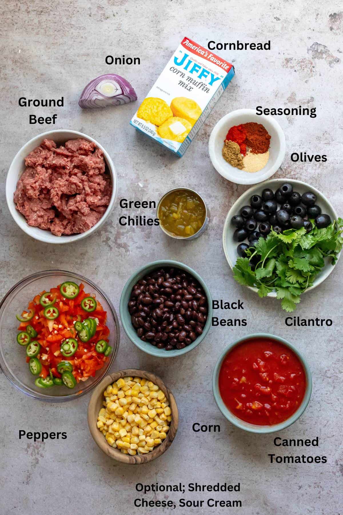 An overhead image of the ingredients of Mexican cornbread casserole with labels.