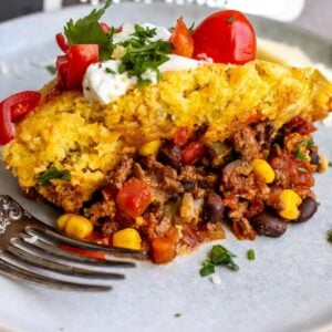 An image of a serving of Mexican cornbread casserole on a plate.
