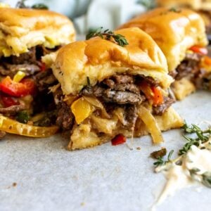 An image of philly cheesesteak sliders.