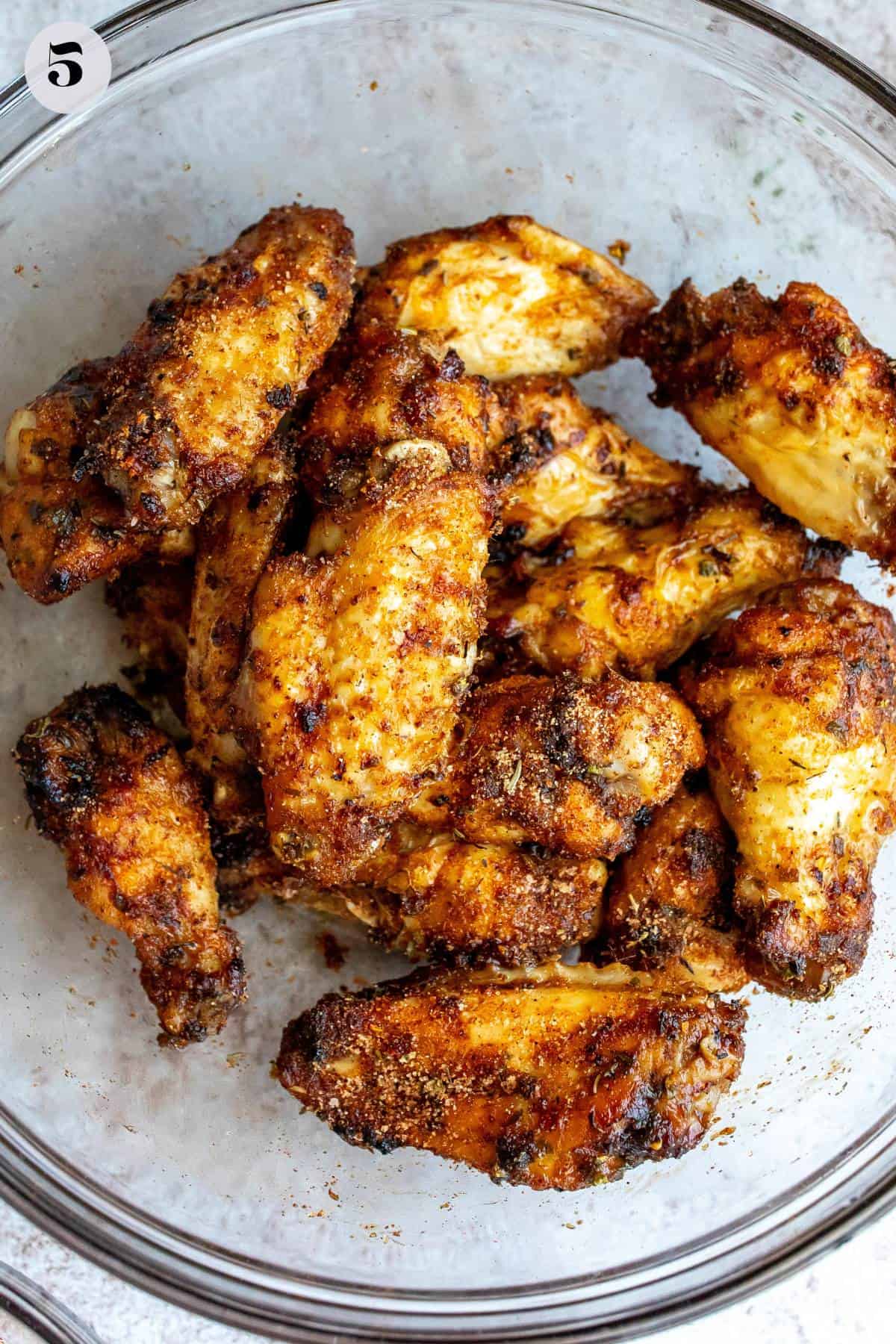 An overhead image of cooked dry rub wings.