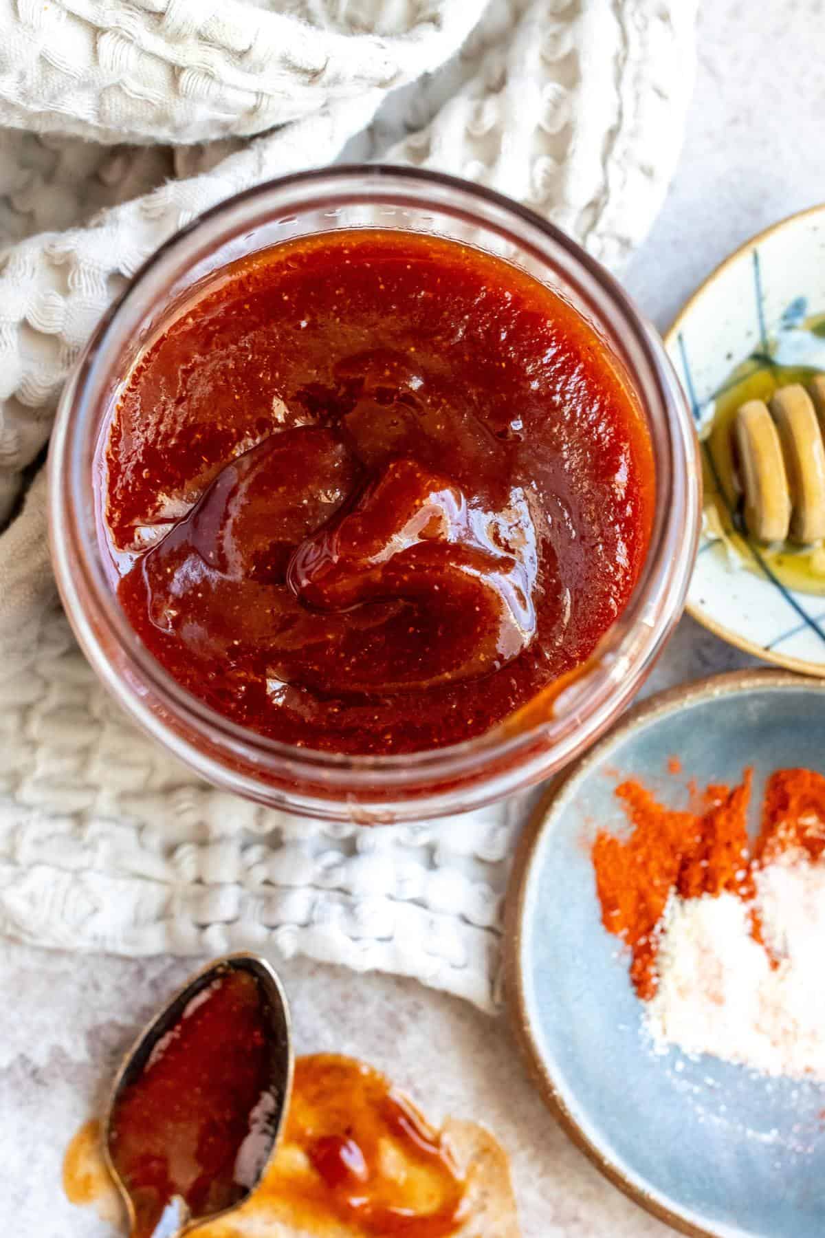 An image of honey bbq sauce in a small bowl.