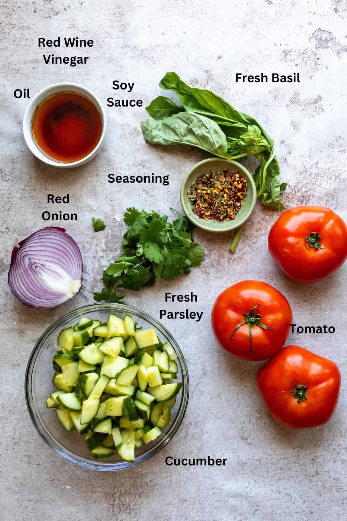 Ingredients needed to make the salad on a counter.