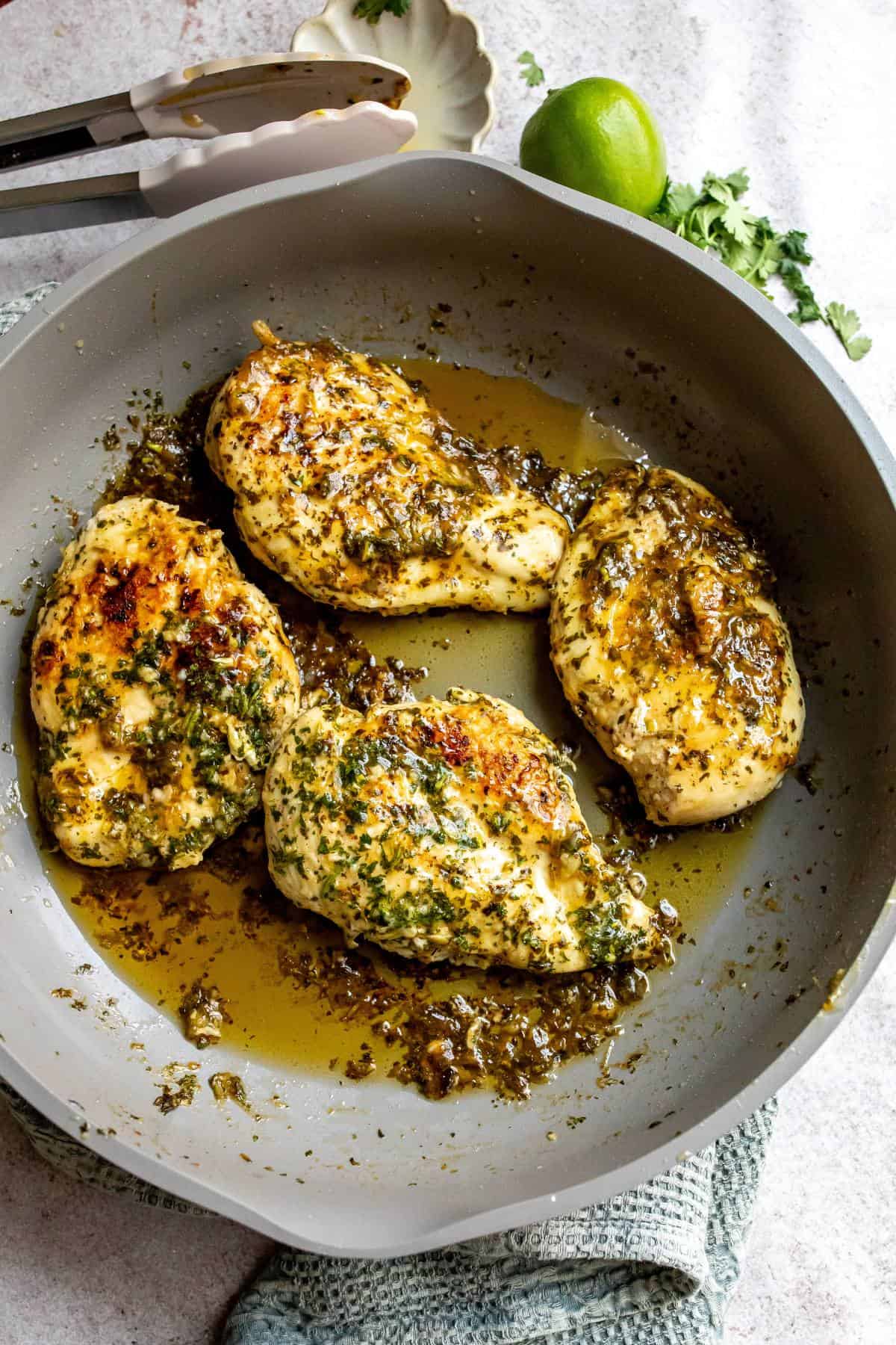 Grey skillet with Lime Chicken Marinade Cilantro in it cooked. 