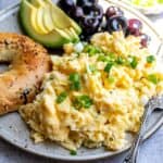 Cottage Cheese with Scrambled Eggs up close on a plate with a fork to the side.