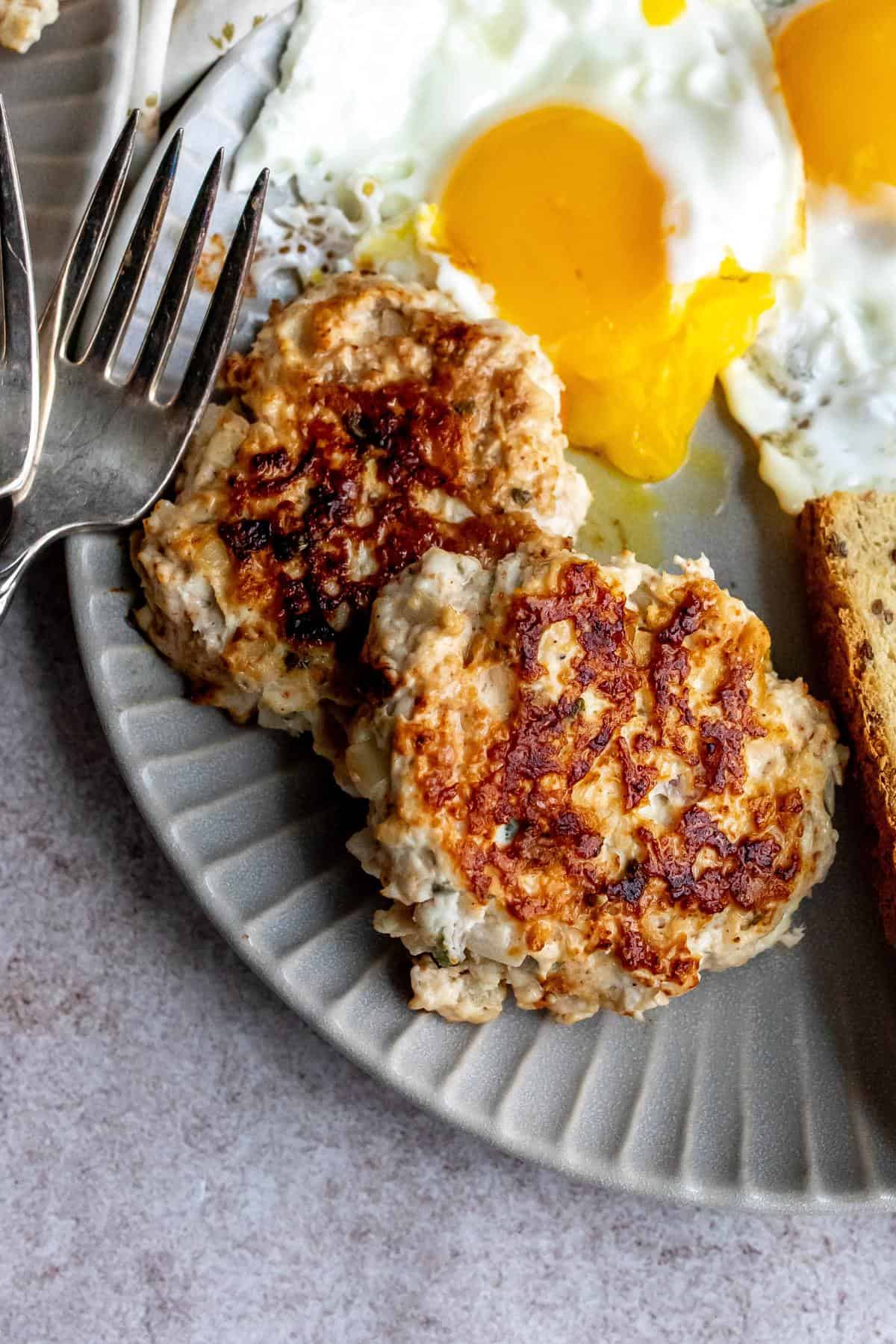 A close up image of chicken and apple sausage.