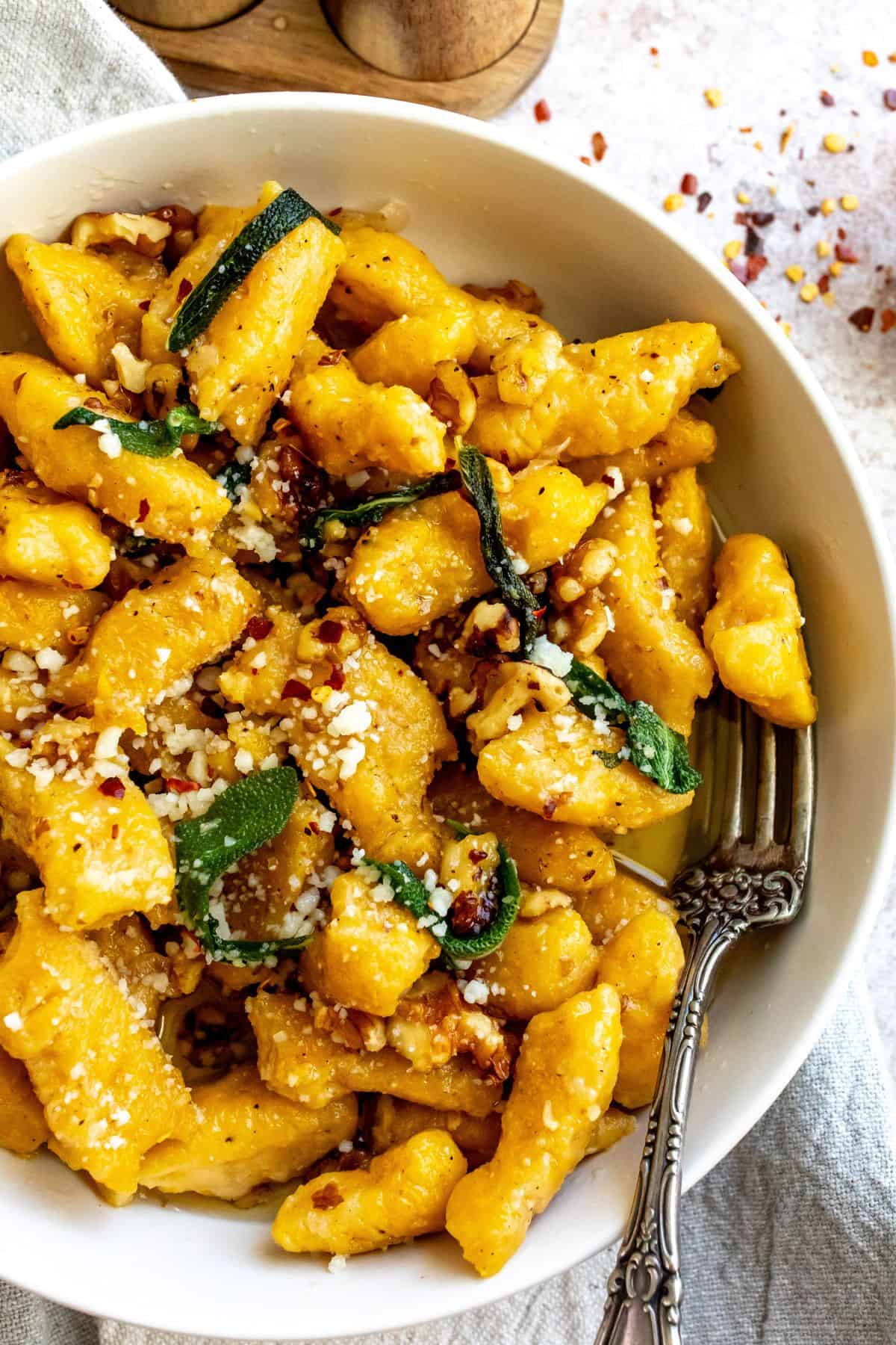 A close up image of butternut squash with gnocchi.