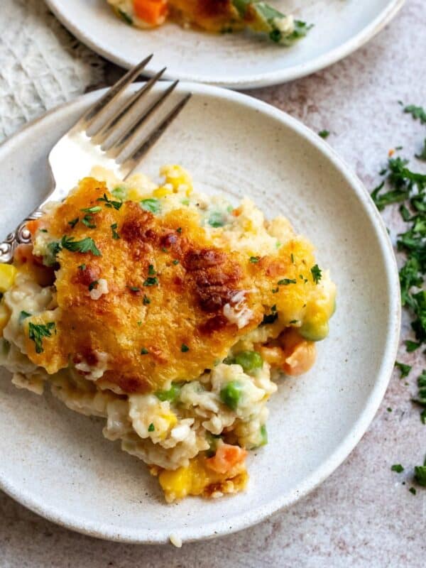 An image of a slice of chicken cobbler on a plate.