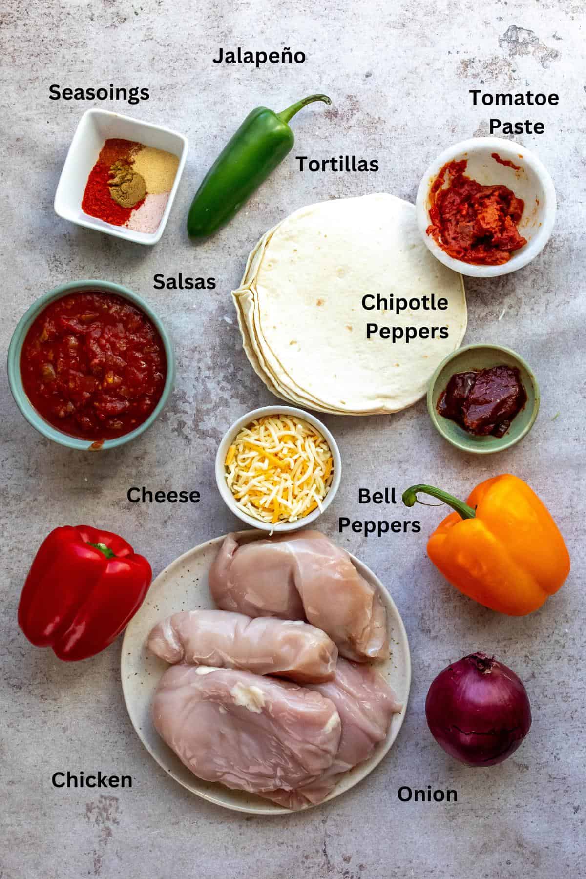 Ingredients on a counter in small bowls and cups. 