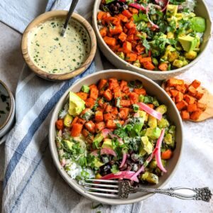 Sweet Potato and veggies in grey Bowls on a dish towel.