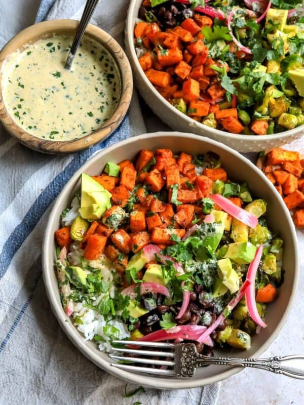 Sweet Potato and veggies in grey Bowls on a dish towel.