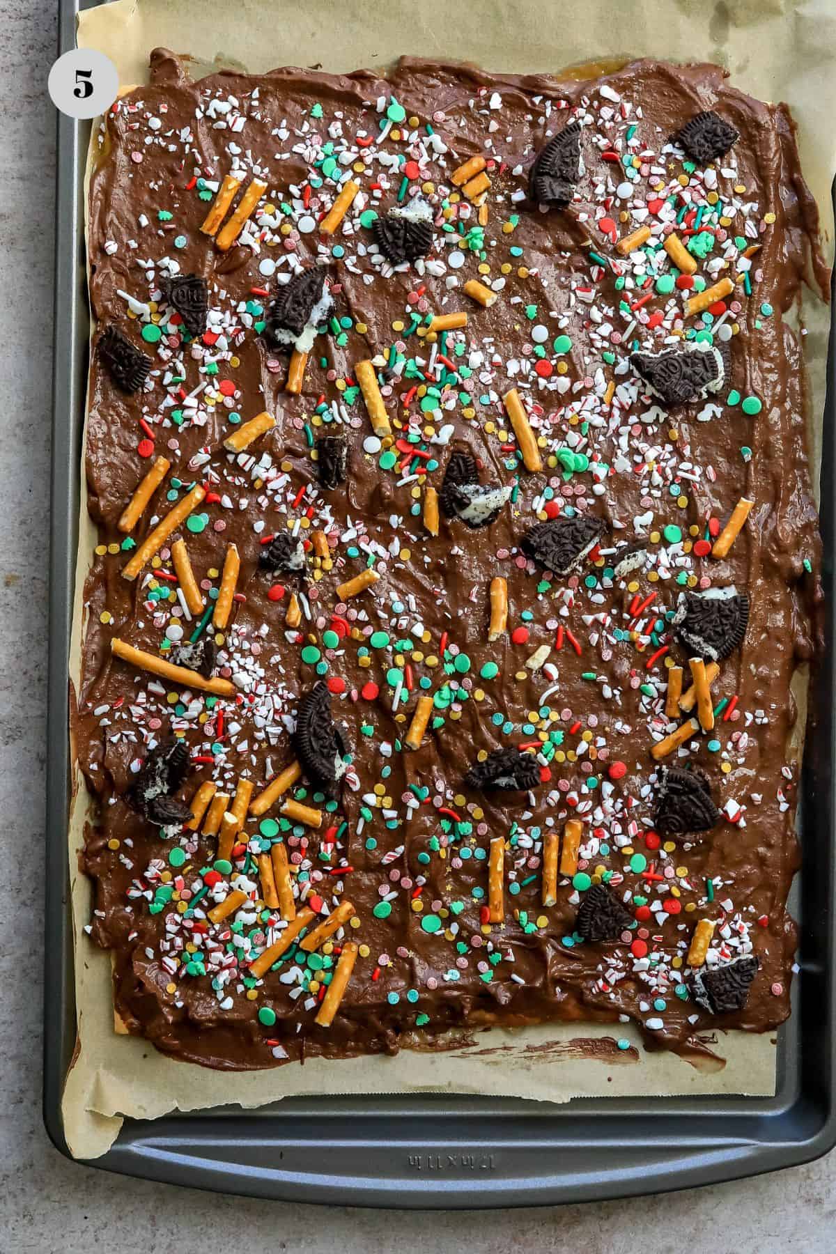 Baking sheet with chocolate bark and sprinkles. 