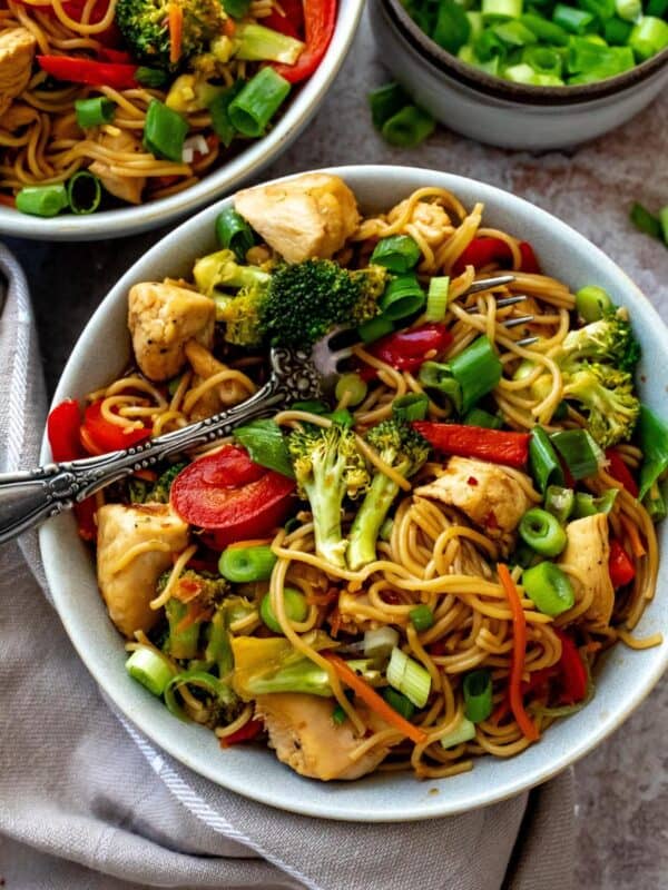 Teriyaki Chicken Ramen in a grey bowl with a dish towel on the side.