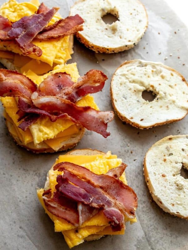 Freezer Breakfast Bagel Sandwiches on parchment paper.