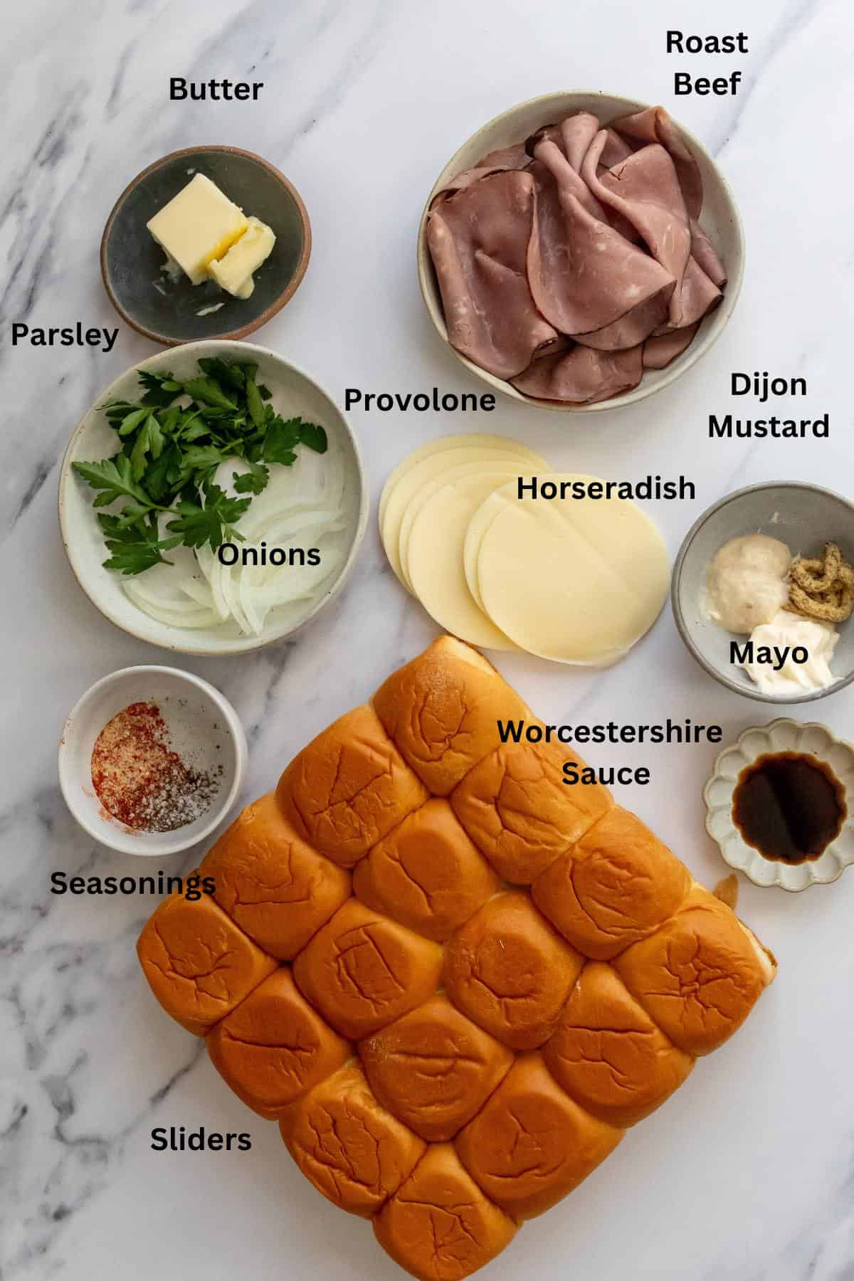 Ingredients needed to make this recipe on a white counter in small bowls. 