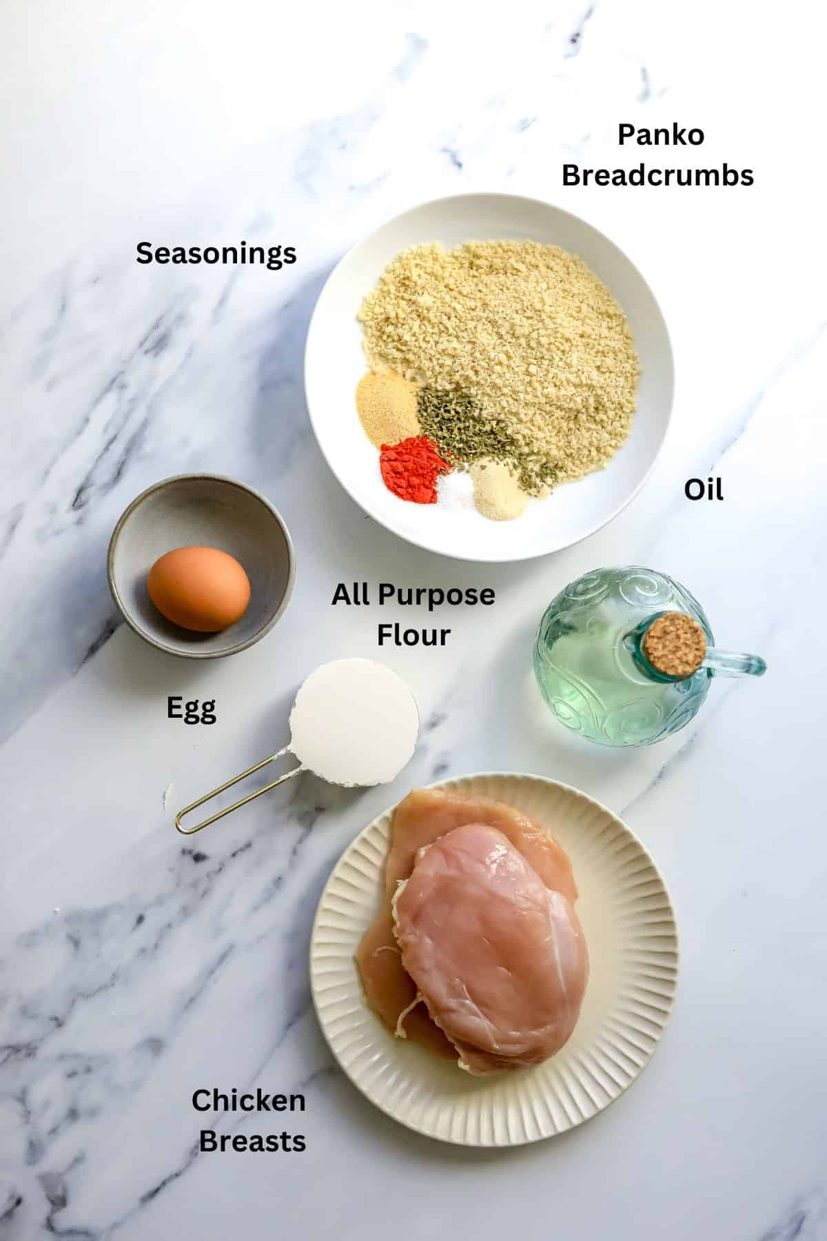 An image of the ingredients of air fryer chicken cutlets on a table.