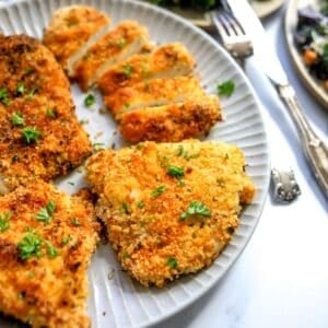 An image of air fryer chicken cutlets on a plate.