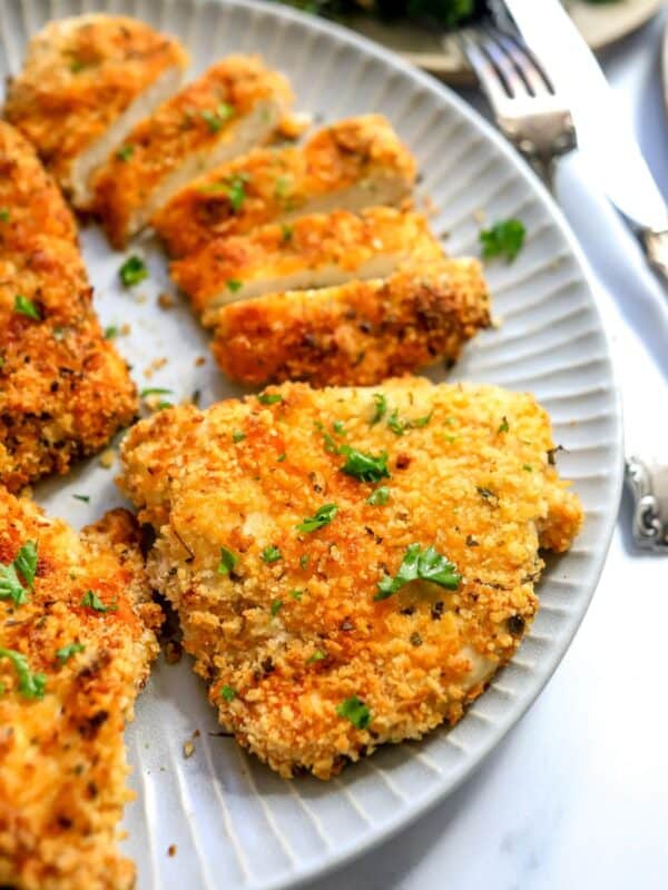 An image of air fryer chicken cutlets on a plate.