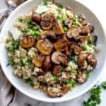 An overhead image of mushroom pea risotto in a bowl.