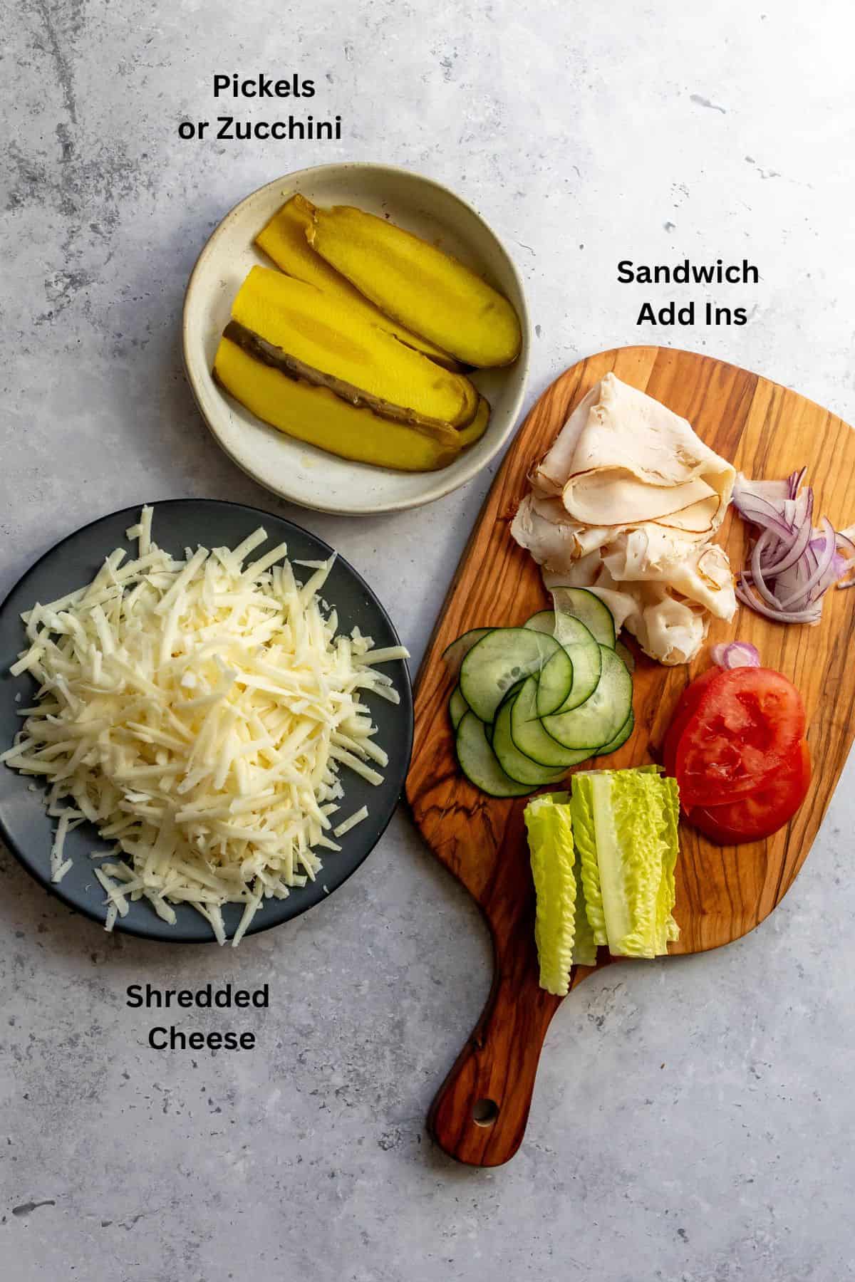 Ingredients on a counter on grey plates.