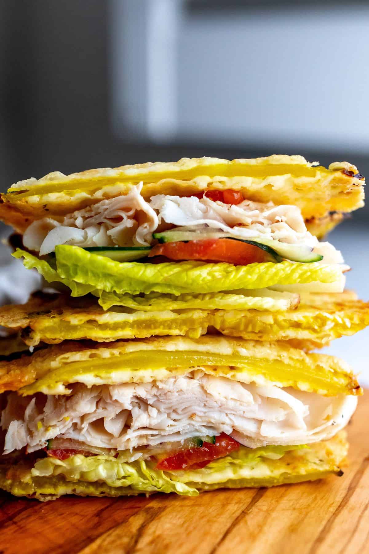Viral cheese and pickle wrap bread stacked on a plate.