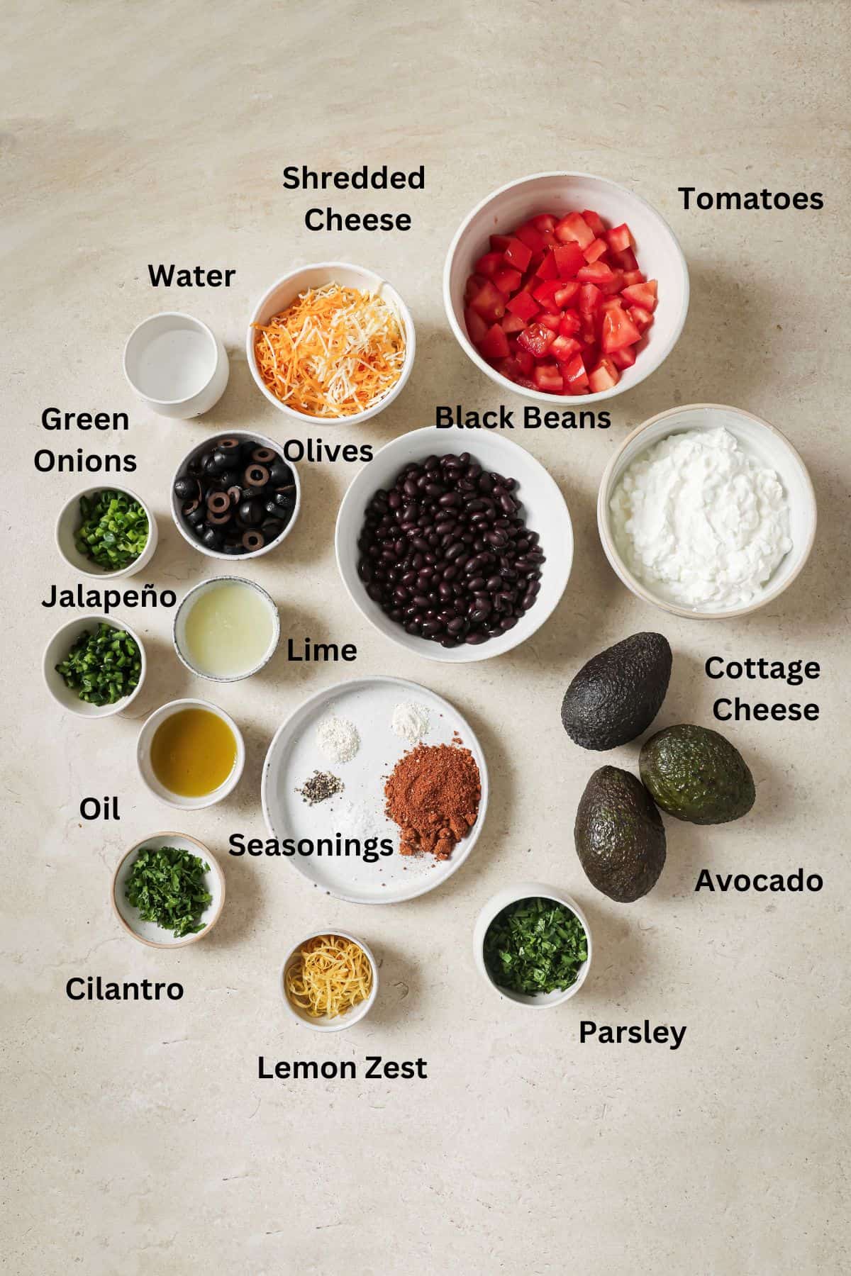 An overhead image of the ingredients of 7 layer dip.