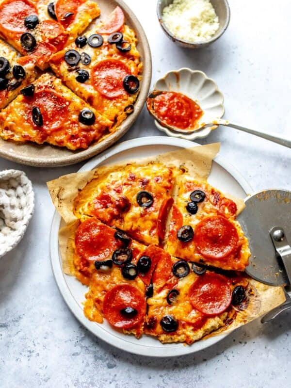 Chicken Pizza Crust on plates with a spoon to the side.