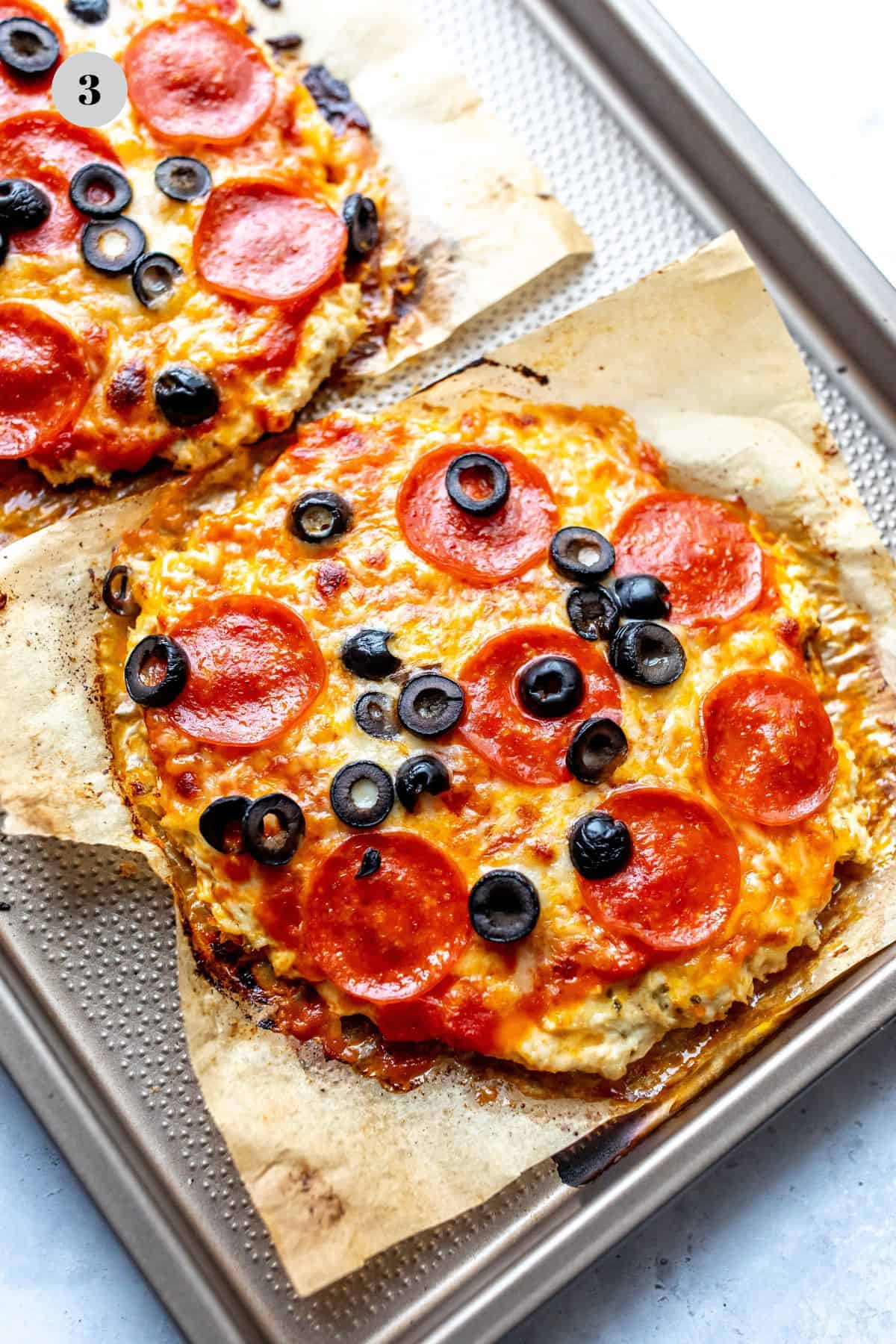 Chicken pizza crust on parchment paper.