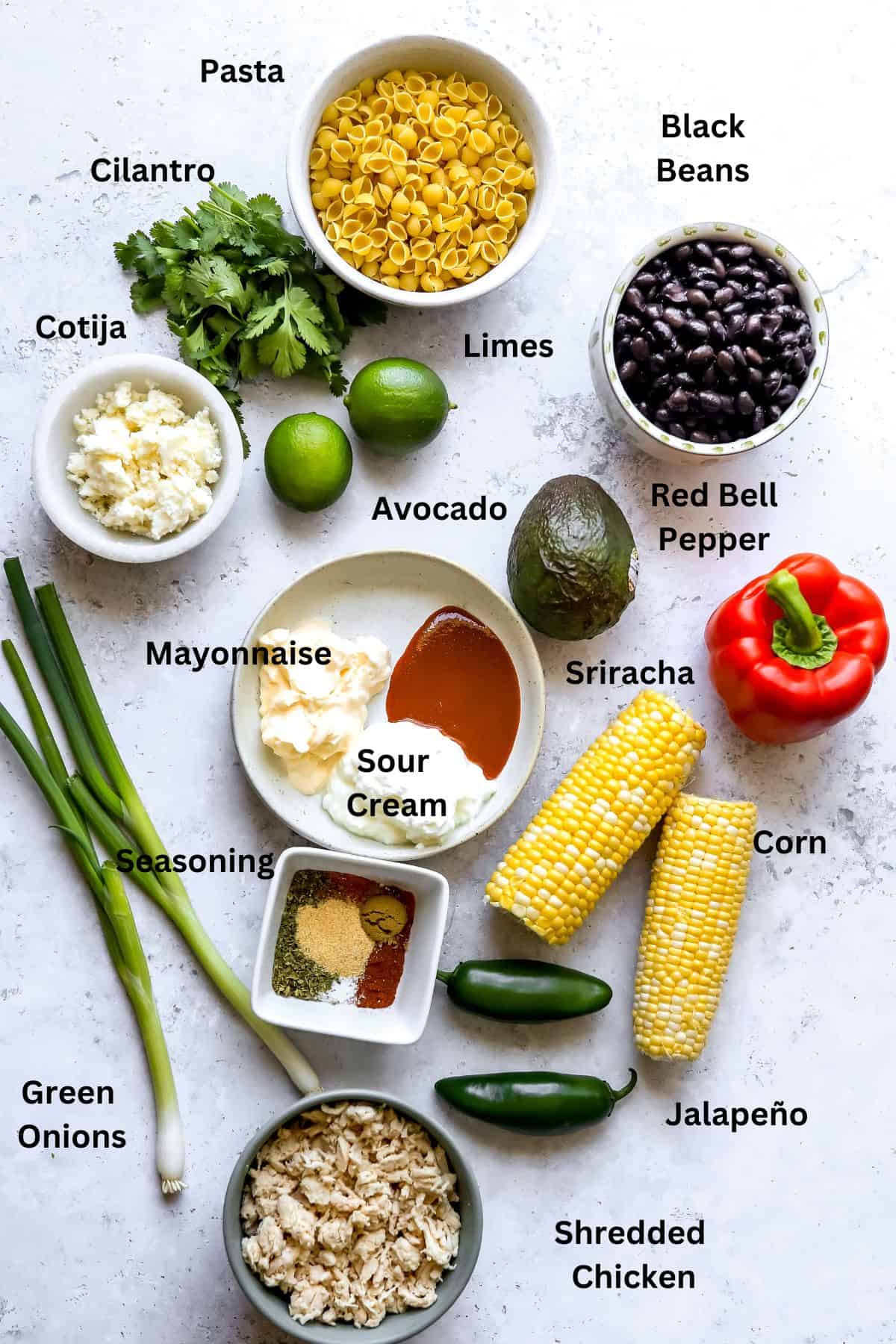 Ingredients to make this recipe in ceramic small bowls on a white counter. 
