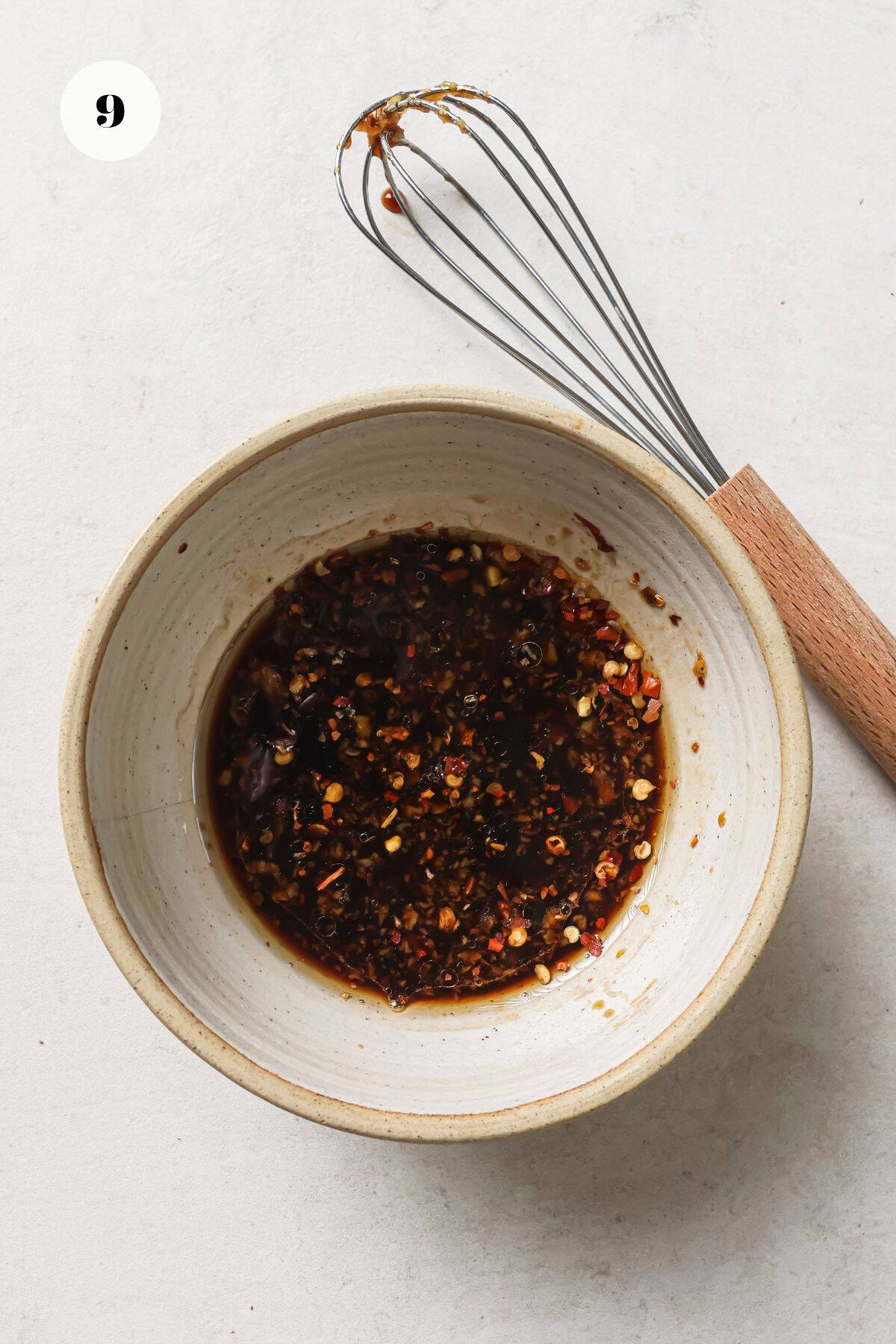 Soy Dipping Sauce in a bowl with a whisk 