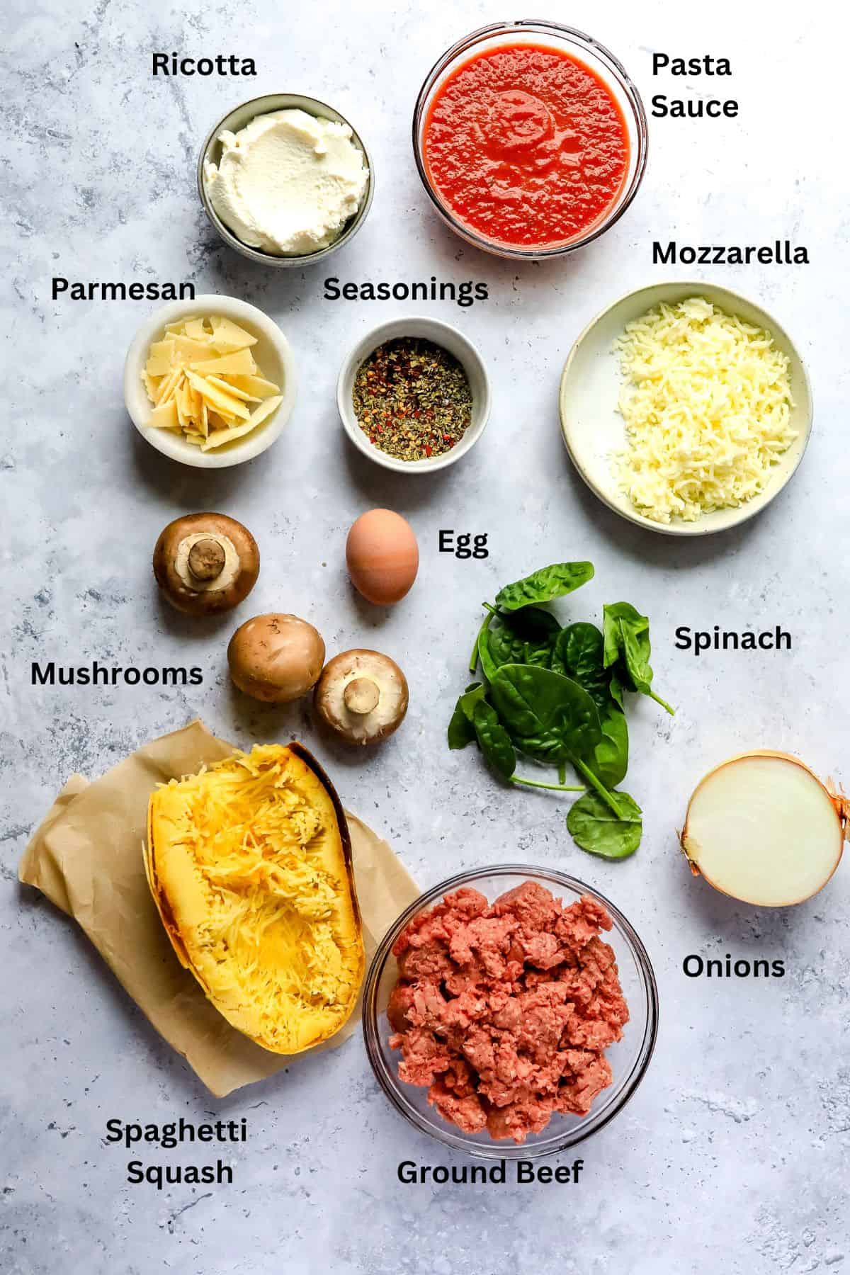 Bowls and plates with ingredients in them on a counter. 